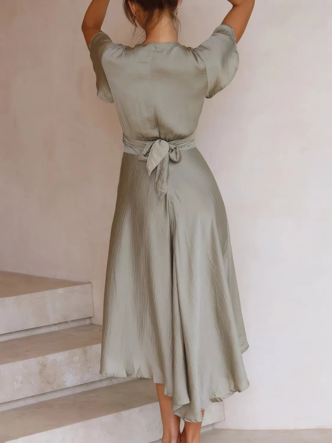 Model wearing High-Low Plunge Flutter Sleeve Dress for cocktail parties