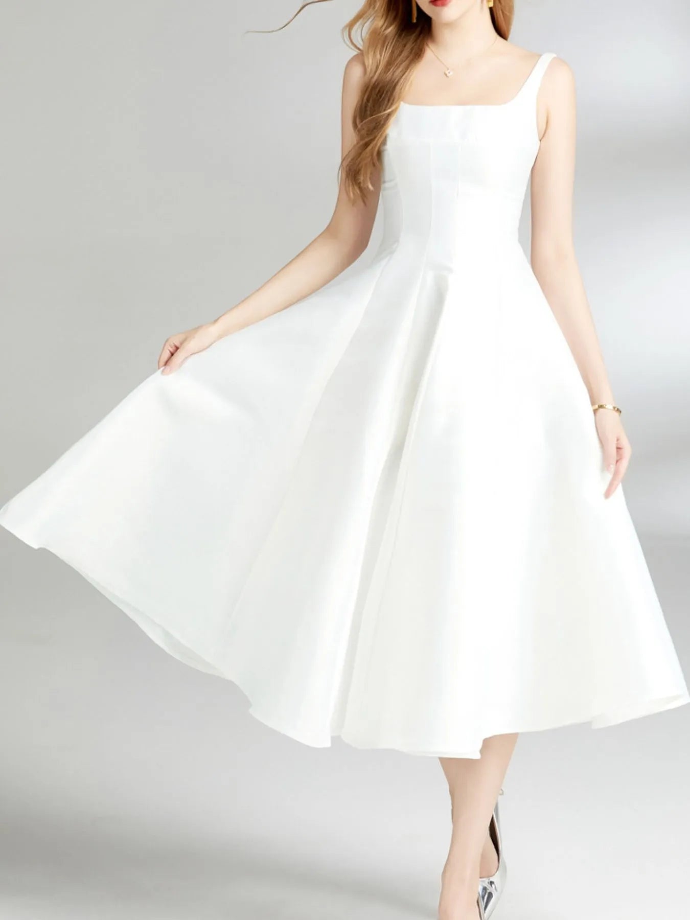 Elegant woman wearing a flowing Polyester Evening Dress, showcasing its sophisticated design and charm.