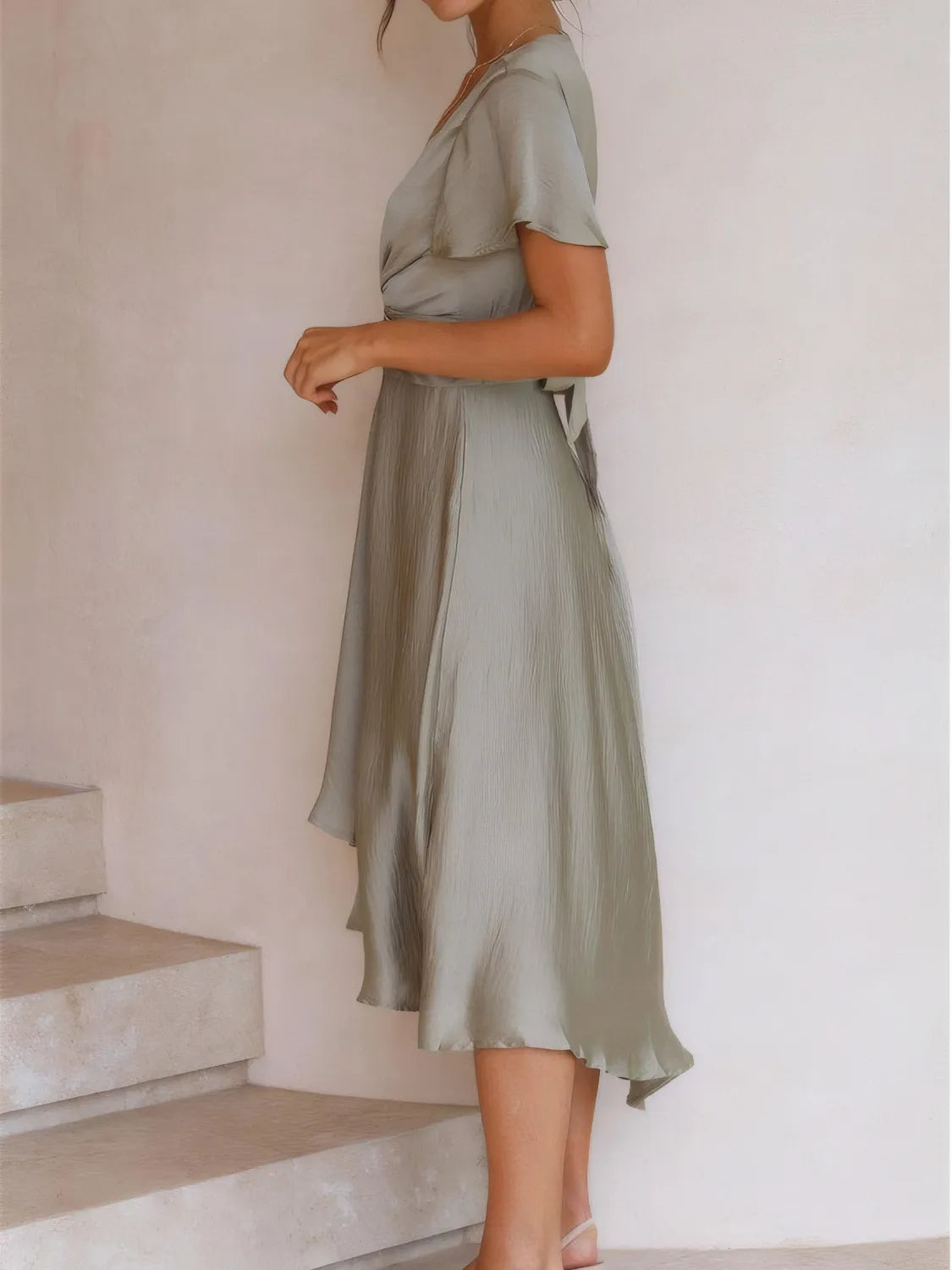 Model wearing High-Low Plunge Flutter Sleeve Dress for cocktail parties
